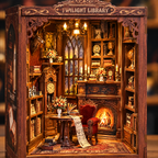 Close-up of the lit book nook interior with clock, armchair and fireplace