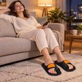 Woman relaxing with her feet on the glowing Solace EMS pads